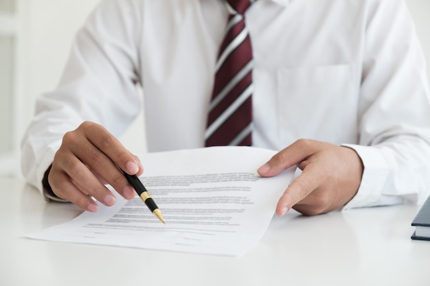 Close up businessman signing contract partnership agreement making deal