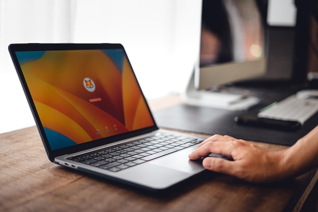 Close up of businessman working and login on laptop