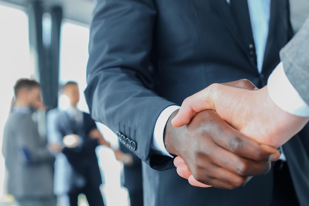 Close up of the businessmen shaking hands