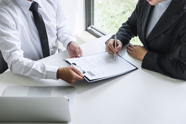 Close up of businessmen signing a contract