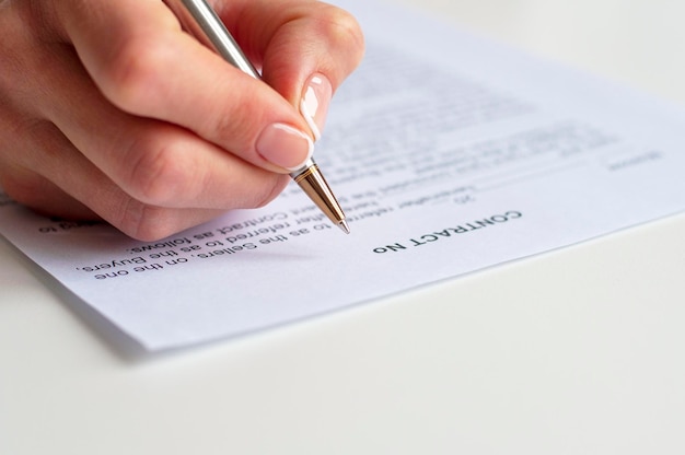 Close Up Of A Businesswoman Signing Contract