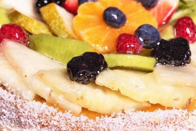 Close up of a cake with fresh fruits.