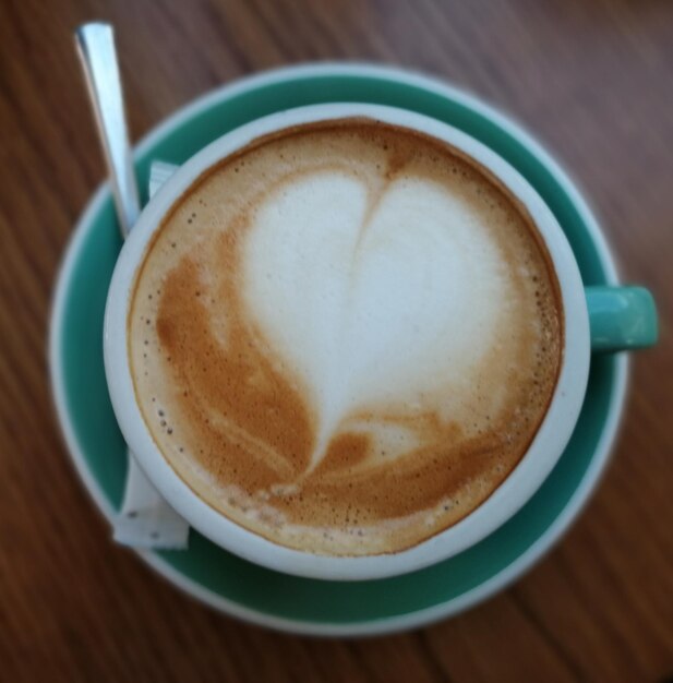 Close-up of cappuccino on table