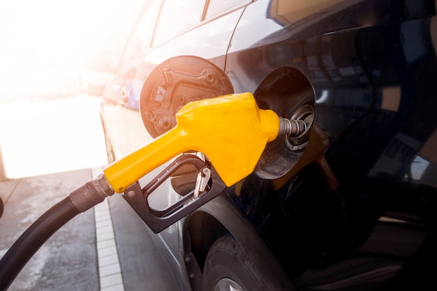 Close up of car is refilling oil fuel in Gas Station 