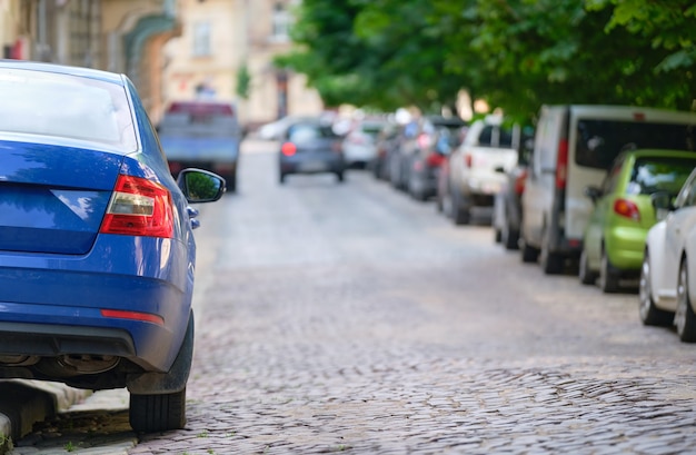 Close up of a car parked illegally against traffic rules on pedestrian city street side.