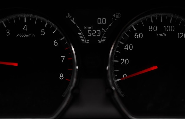 A close up of a car's dashboard showing the time of 5 : 23.