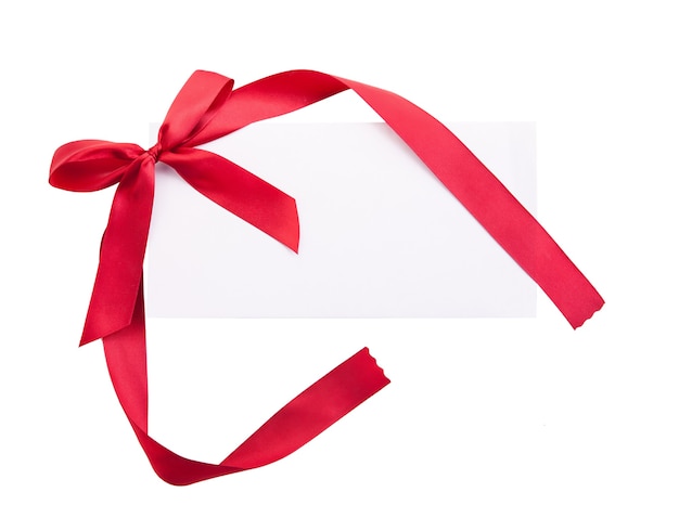 Close up of card note with red ribbon isolated on white background