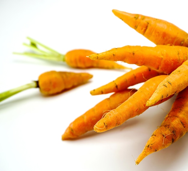 Close-up of carrots on white background