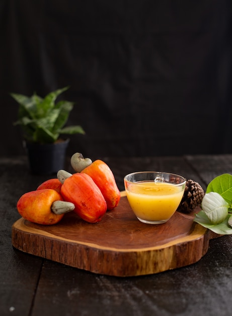 Close up on cashew juice on a wooden board