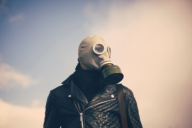 Close up. casual guy in a gas mask . photo with a copy-space