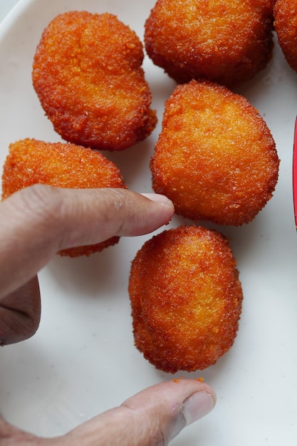 Close up of chicken cheese meat ball on plate