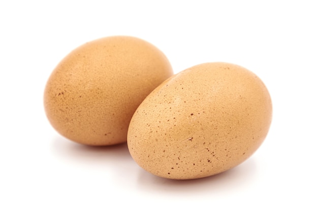 Close up of chicken egg isolated on white background