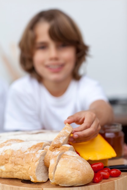 Close-up of child's hand taking bread