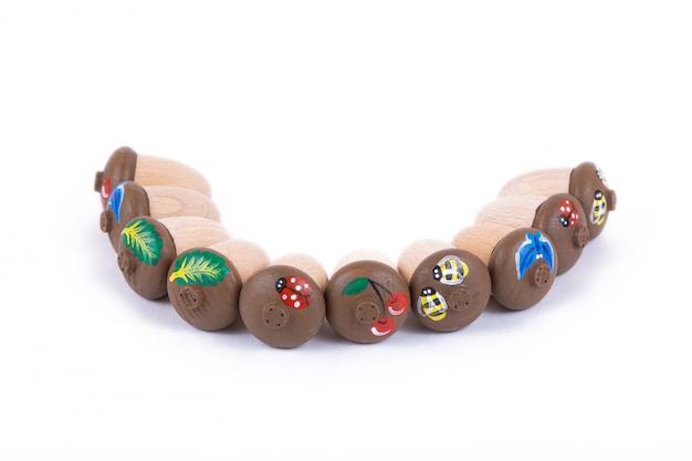 close-up of children's toys made of natural wood in the form of acorns with shells