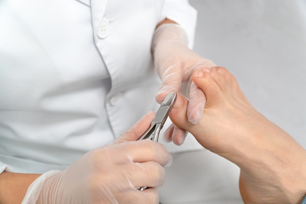 Close up of a chiropodists hands doing chiropody