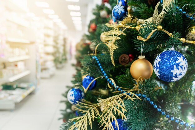 Close-up of christmas decorations hanging on tree