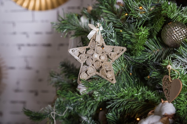 Close up Christmas tree ornaments in bronze and golden tones