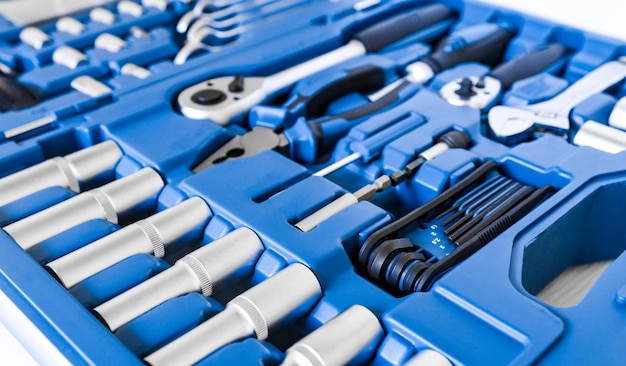 Photo close-up of chrome shiny tools in a blue storage case repair and construction equipment for work