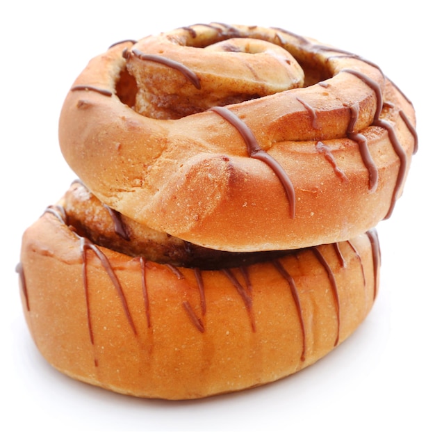 Close up of a cinnamon bun isolated against white background