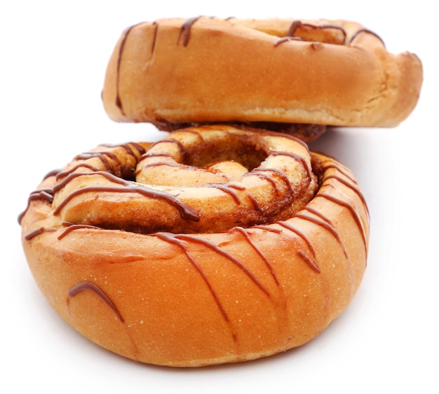 Close up of a cinnamon bun isolated against white background