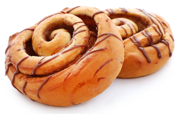 Close up of a cinnamon bun isolated against white background