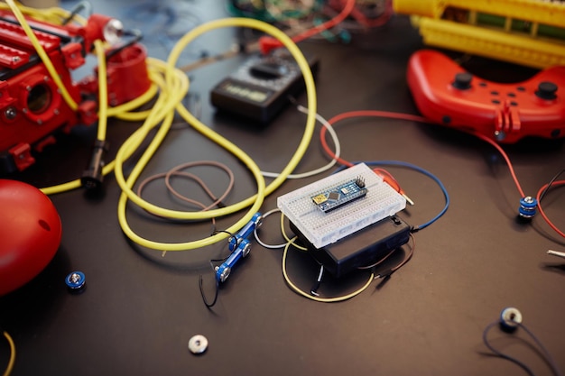 Close up of circuit board with wires and cables in robot engineering class or workshop activity