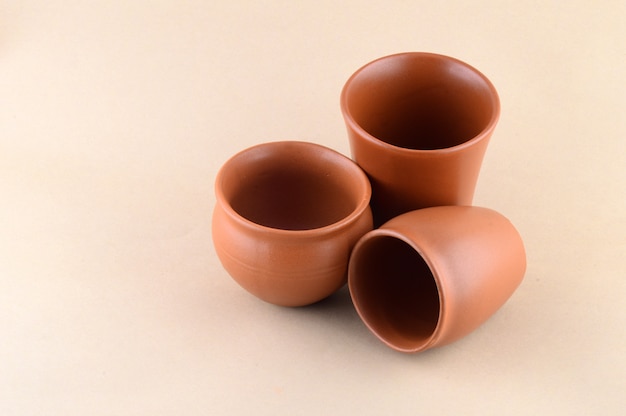 Close-up of Clay pots on cream color