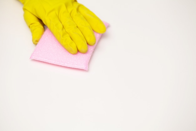 Close Up cleaning company worker hand holding sponge