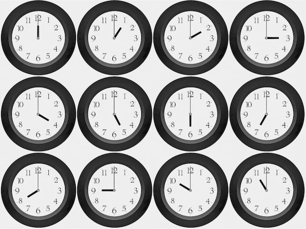 Photo close-up of clocks showing various timings against white background