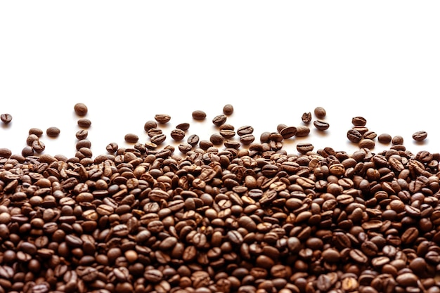 Close-up of coffee beans against white background