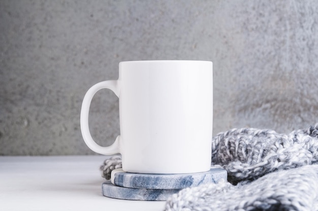 Close-up of coffee cup on table against wall at home