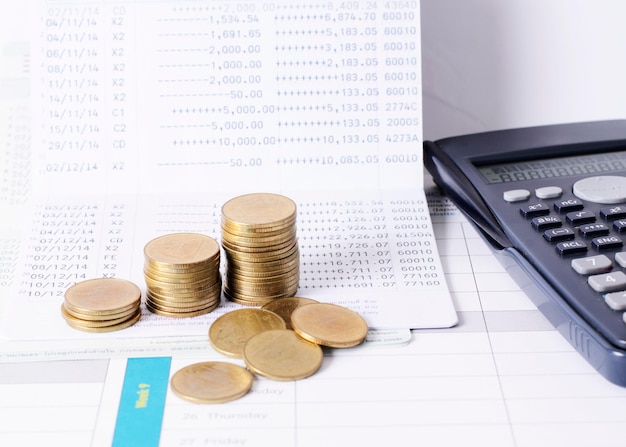 Close-up of coins on bank passbook