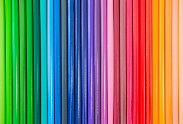 Close-up of colored pencil arranged in a row