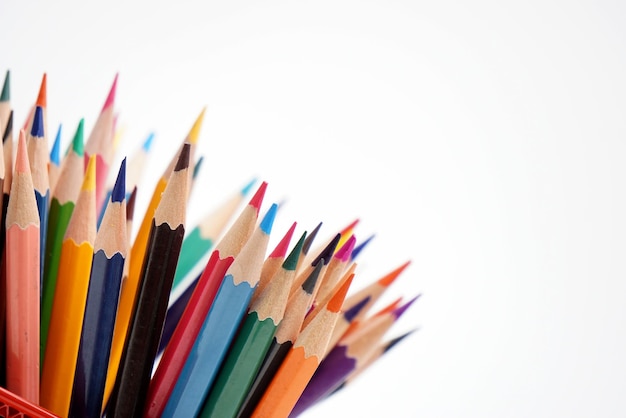 Close-up of colored pencils against white background