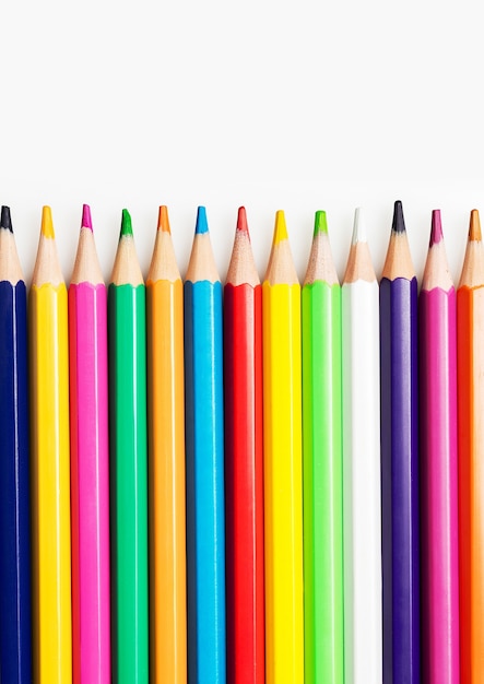 Close up of colorful crayons on white background