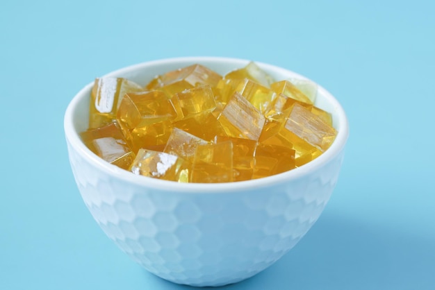 Close up of colorful jelly on plate on table