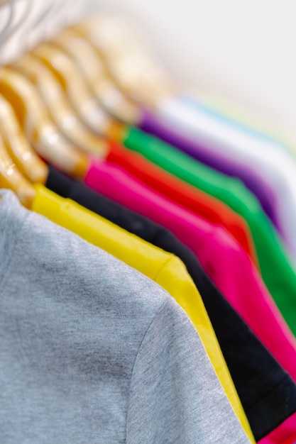 Close up of Colorful t-shirts on hangers