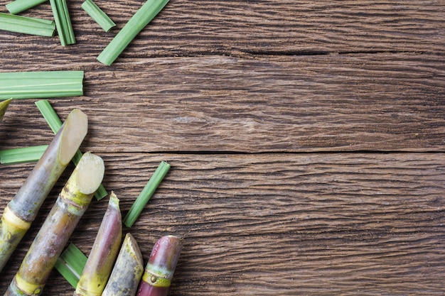 Close up concept sugarcane on wood background.