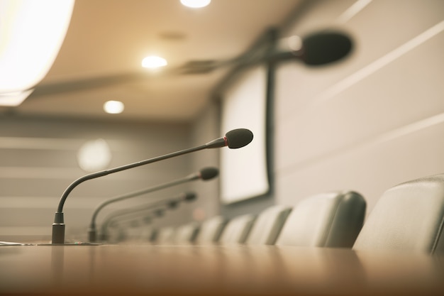 Close up the conference microphone on the meeting table.