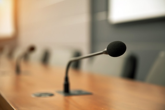 Close up the conference microphone on the meeting table.