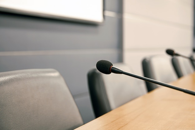 Close up the conference microphone on the meeting table.