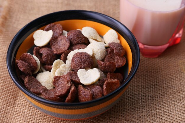 close up of corn flakes in a bowl on table