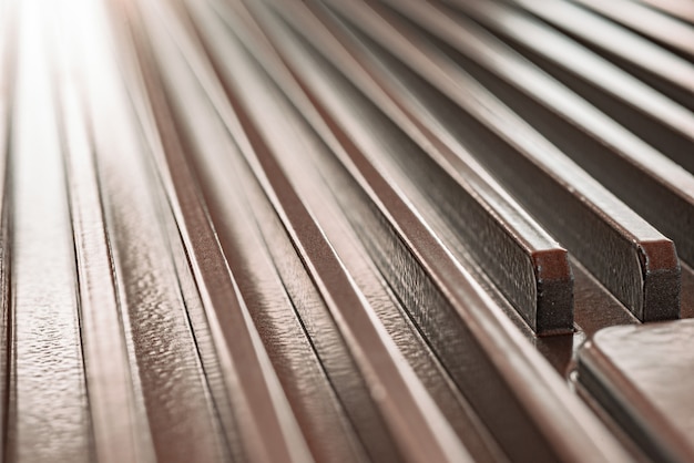 Close-up of a corrugated metal surface of an unidentified factory equipment. The concept of sophisticated equipment and modern technology. The concept of the production of military devices