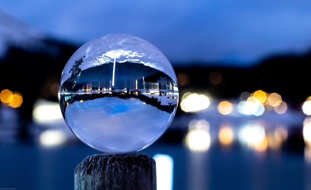 Photo close-up of crystal ball against blue sky