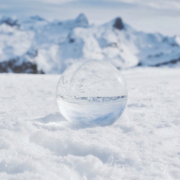 Photo close-up of  crystal ball on land against sky