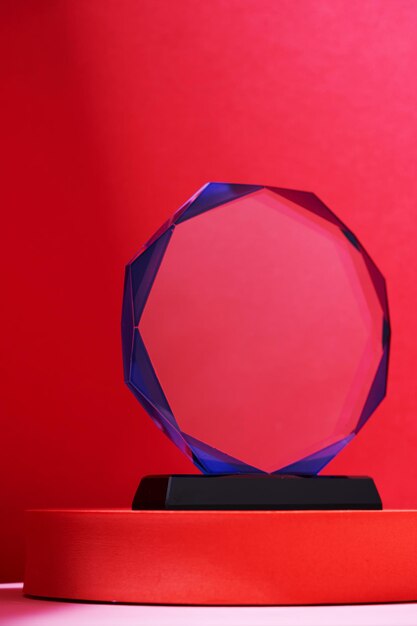 Close up crystal trophy on the red background