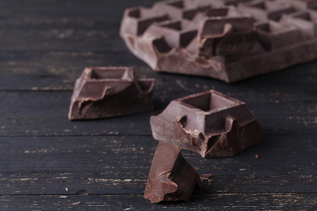 Close up dark chocolate on rustic table