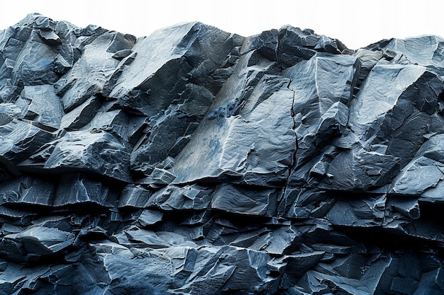 Close up of a dark gray rock mountain cliff isolated on a white background with a clipping path and