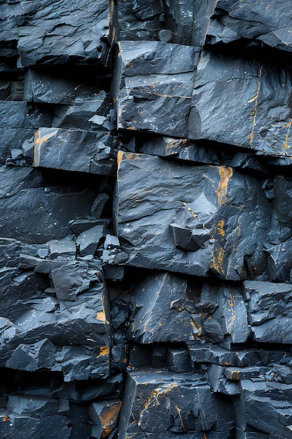 Close up of dark gray rock mountain cliff isolated on white background