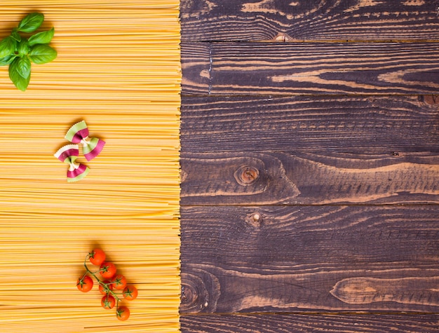 Close-up of decorating Italian pasta. On a wooden background